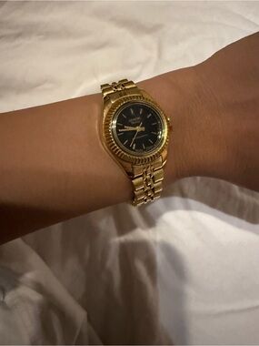 Geneva Gold Tone Watch with Black Dial
